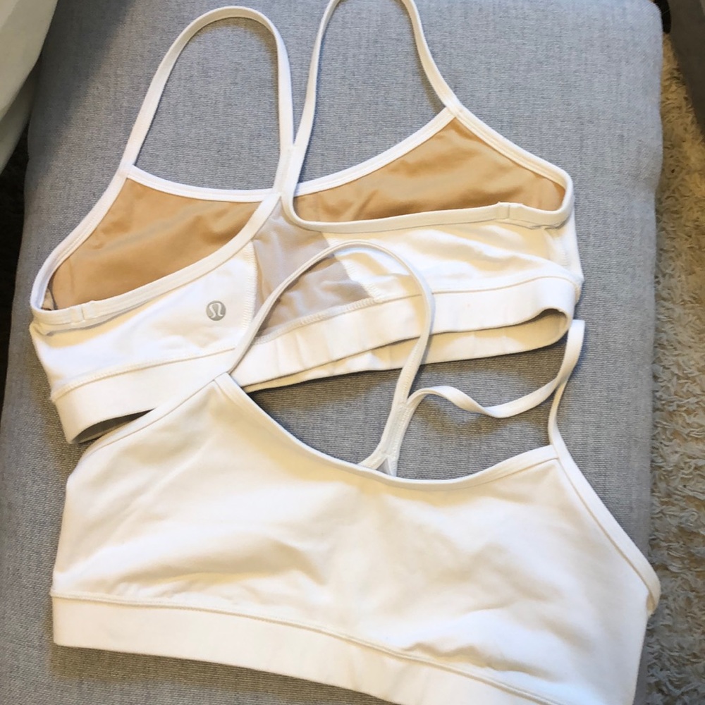 Two white Lululemon fly bras